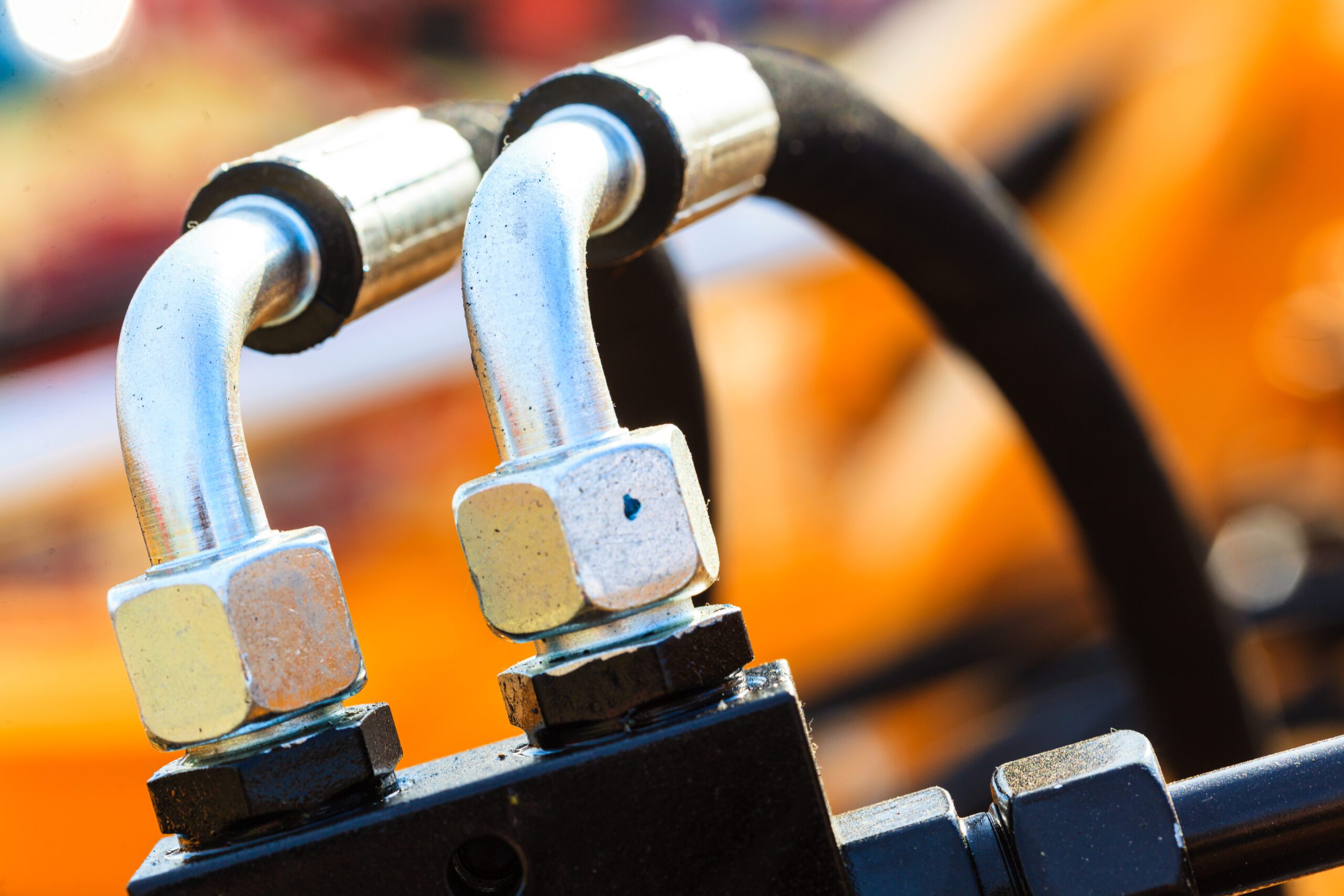 hoses, connections and yellow machinery to illustrate Pneumatic Components: Complete, Integrated Power Solutions