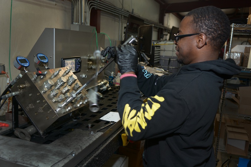 A man working at Hydra Power Systems.